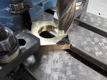  Clamping set up #2 - successful!  After finding the center of the strap, we move over, drill the ram mounting hole and machine the strap end down to the proper thickness.